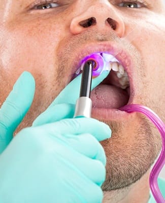 person getting their tooth bonded
