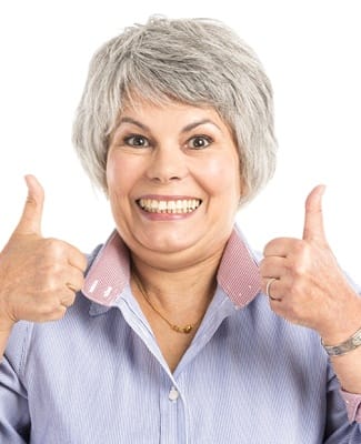 woman smiling with both thumbs up