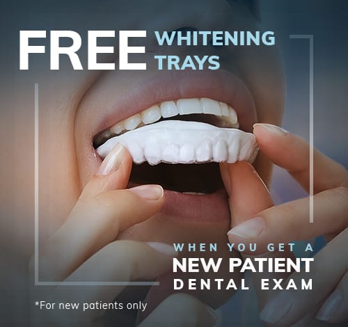 woman putting in whitening tray