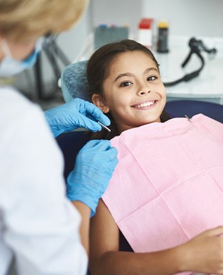 Child smiling at the dentist