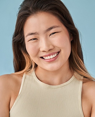 woman smiling with dental bridges in Federal Way