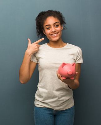 woman with piggy bank pointing to her smile 