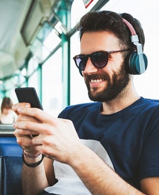 person sitting on a bus and smiling