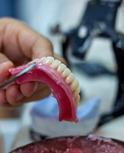 technician making dentures 
