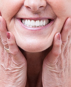 closeup of woman smiling with dentures 