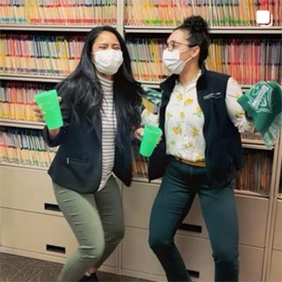 Dental team members holding cups in Federal Way dental office