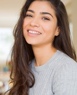 Woman with beautiful teeth smiling at home