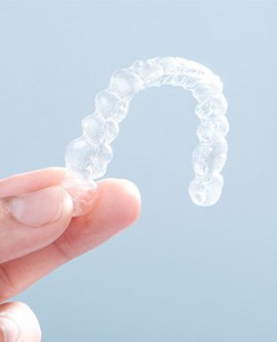 Patient holding clear aligner