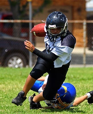 boy playing football