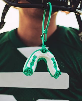 green and white mouthguard