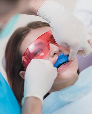 girl getting fluoride treatments