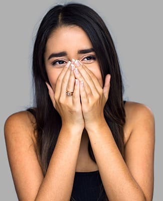 woman covering face