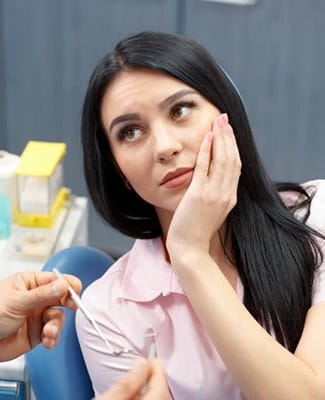 woman in dental chair who needs root canal therapy in Federal Way