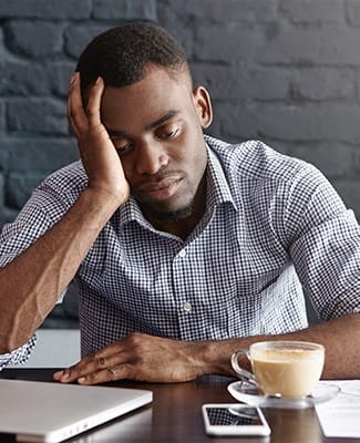 man tired with coffee