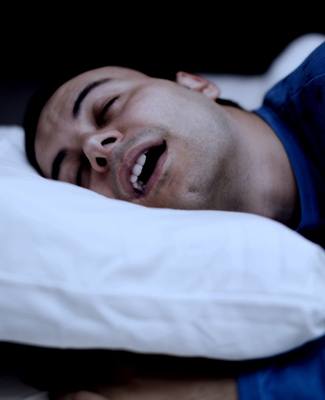 Man sleeping soundly with sleep apnea in Federal Way