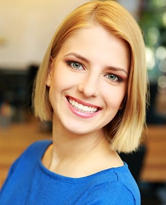 woman in blue smiling