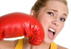 Woman being hit with a boxing glove