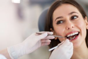 Woman getting an oral cancer screening