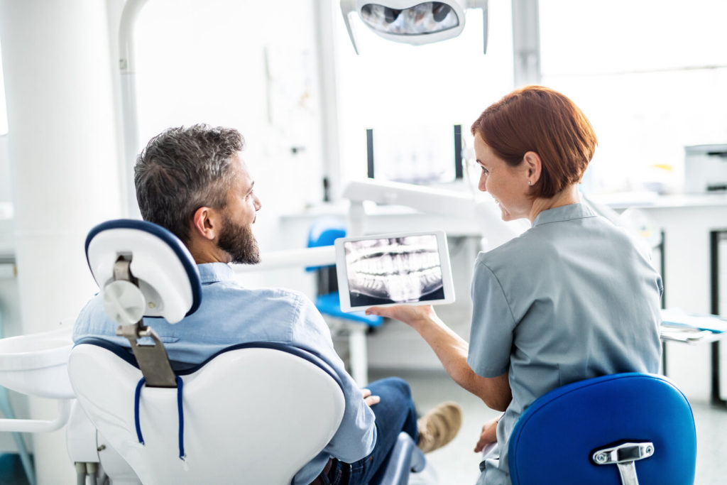 patient learning about the benefits of porcelain veneers in Federal Way