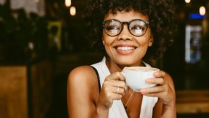 woman drinking coffee with veneers in Federal Way