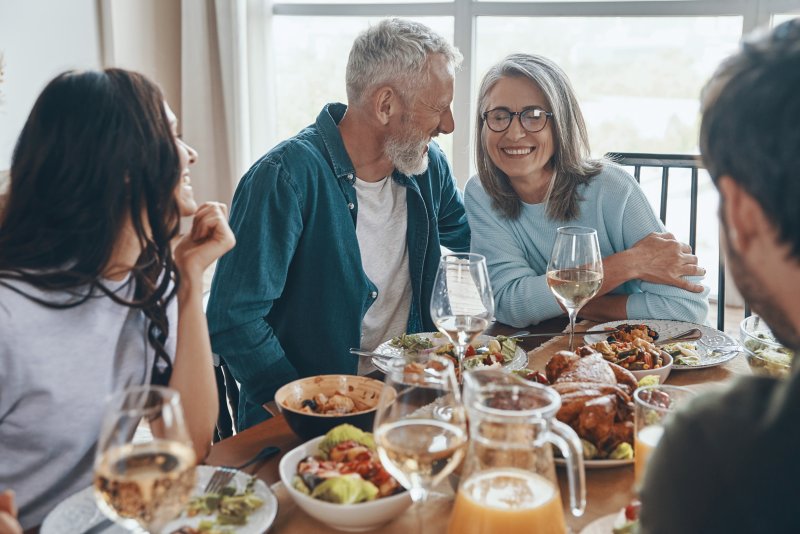 A family enjoying Thanksgiving with good oral health